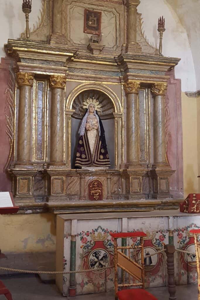 A marble altar in Santa Catalina Monastery with a statue of the Virgin Mary