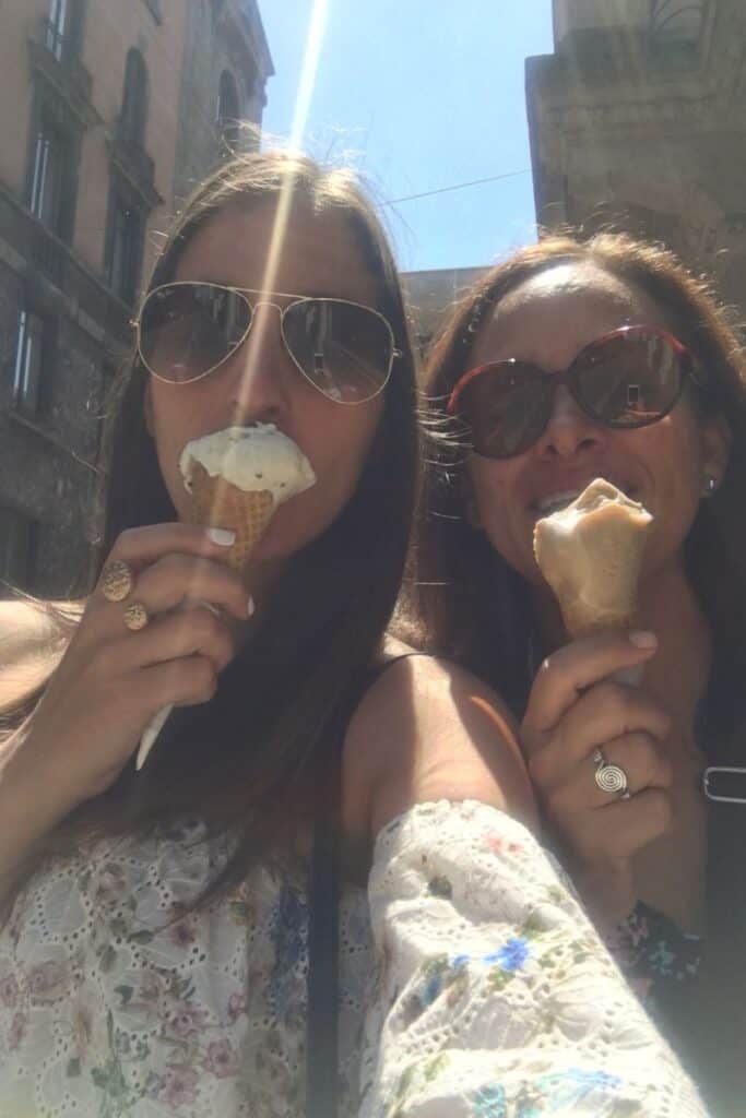 mother daughter eating gelato in milan